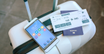 Boarding Pass on top of a suitcase with a smartphone