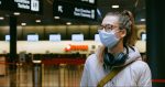 woman wearing face mask at the airport