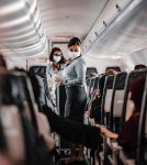 Permalink to 2021 Mask Mandate: Biden Orders Requiring Masks on Planes flight attendants wearing face mask on plane